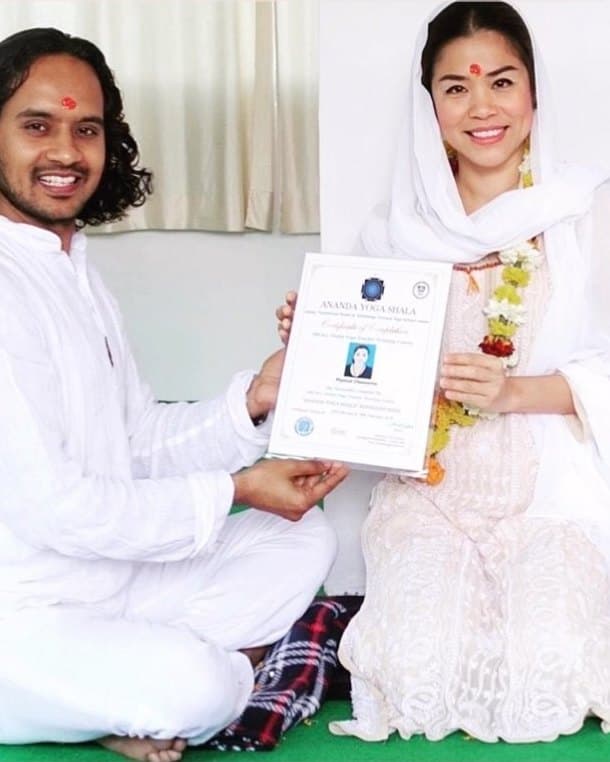 Kai receiving her yoga and Ayurveda teacher certificate